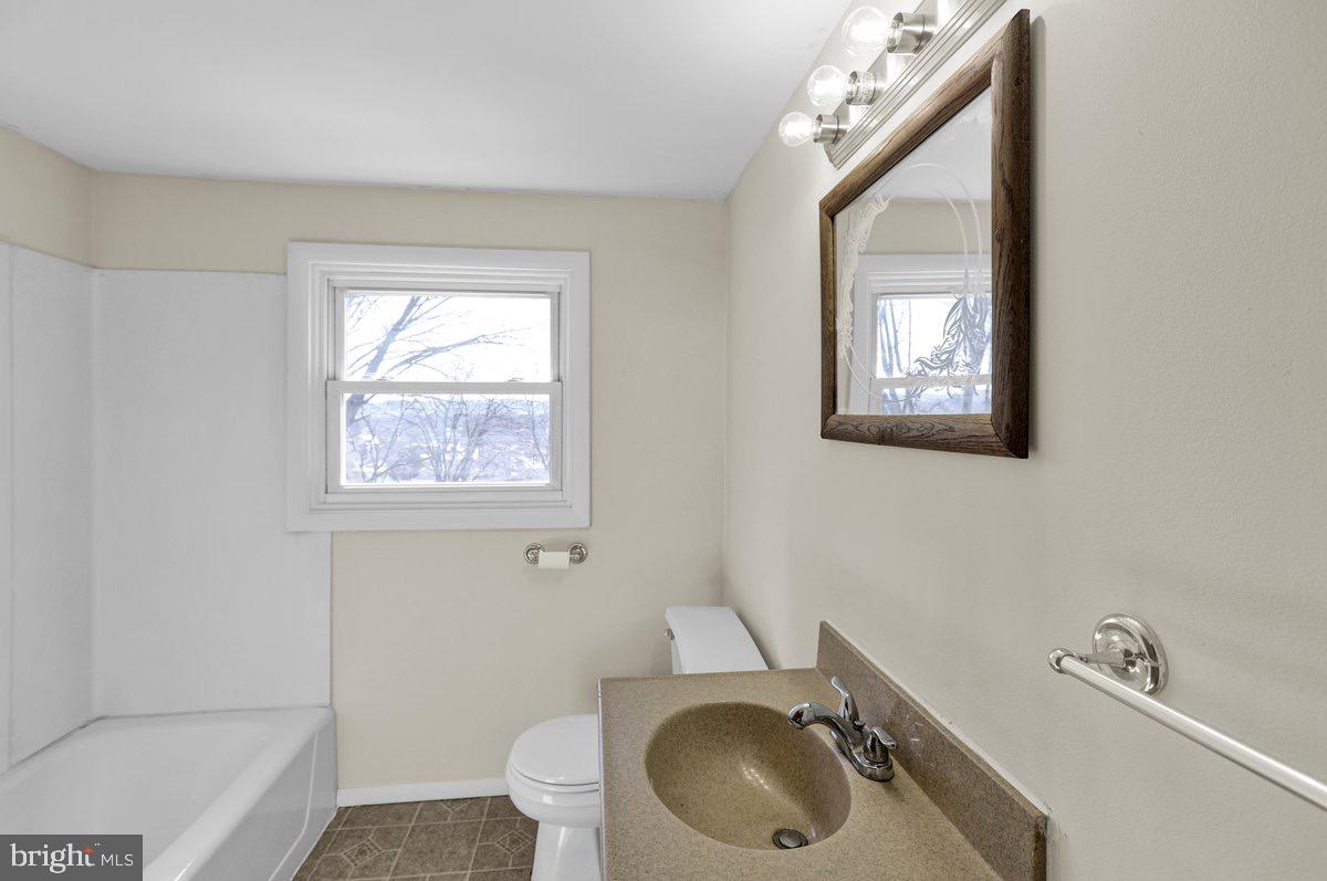 2326 Fairview Street Reading, PA 19609 - Photo 16 of 27 a bathroom with a sink a toilet and a bathtub