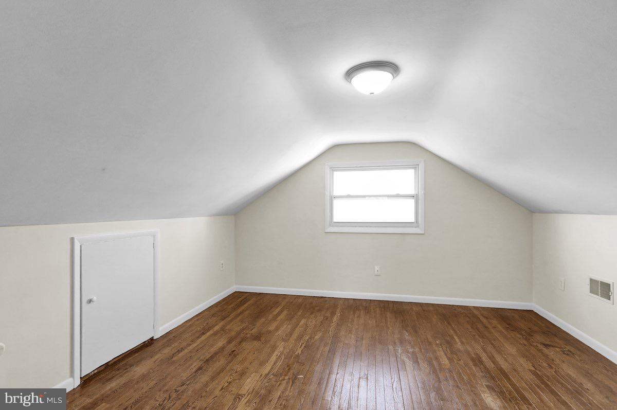 2326 Fairview Street Reading, PA 19609 - Photo 18 of 27 an empty room with wooden floor and windows