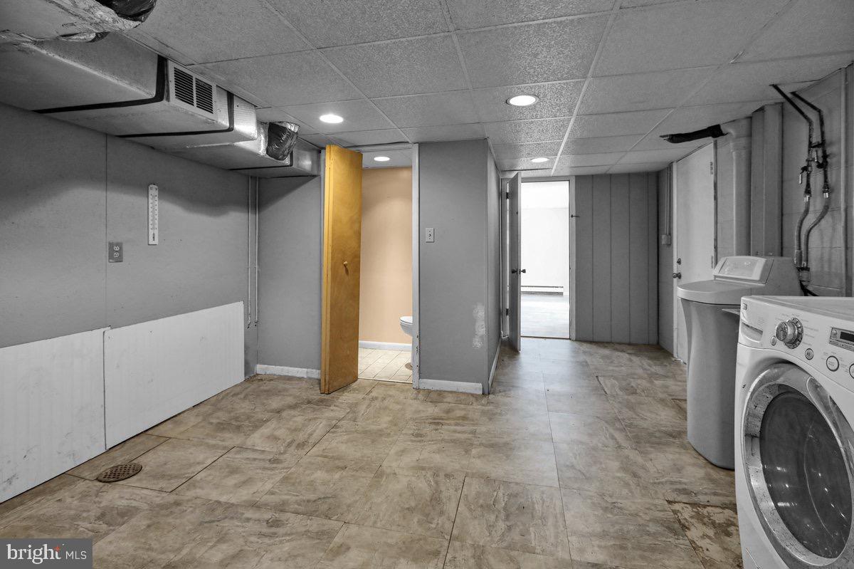 2326 Fairview Street Reading, PA 19609 - Photo 23 of 27 a view of a hallway with washer and dryer