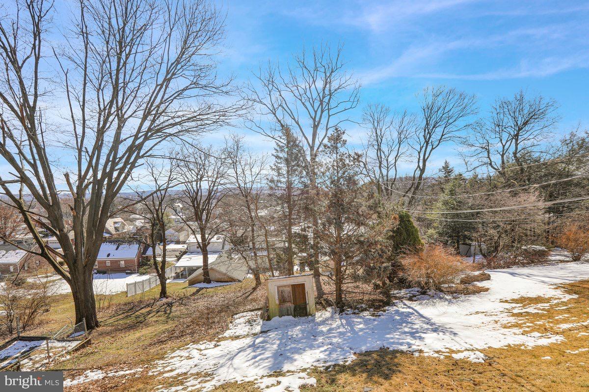 2326 Fairview Street Reading, PA 19609 - Photo 26 of 27 a view of a yard covered with snow in front of house