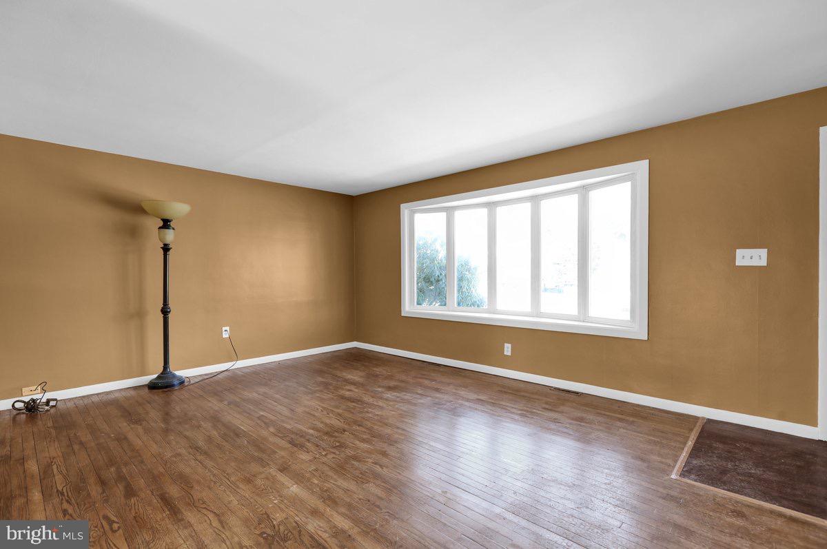 2326 Fairview Street Reading, PA 19609 - Photo 5 of 27 an empty room with wooden floor and windows
