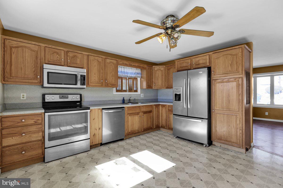 2326 Fairview Street Reading, PA 19609 - Photo 6 of 27 a kitchen with granite countertop a refrigerator oven a sink and dishwasher