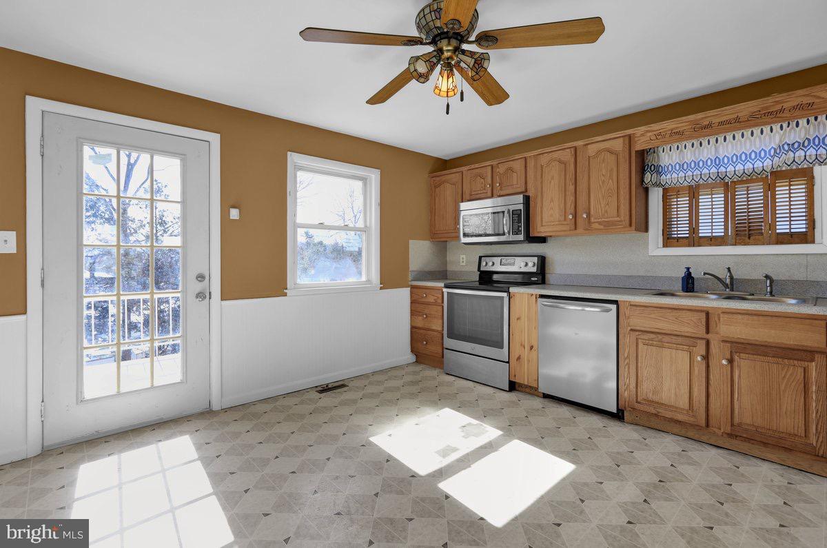 2326 Fairview Street Reading, PA 19609 - Photo 8 of 27 a kitchen with stainless steel appliances granite countertop a stove sink and microwave