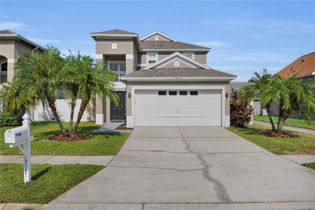 8517 Hawbuck Street Trinity, FL 34655 - Photo 1 of 1 a front view of a house with a yard