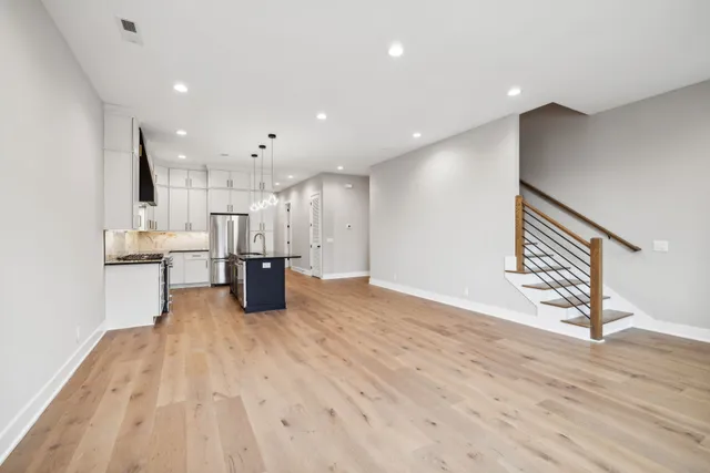 a bathroom with a sink toilet vanity and tub