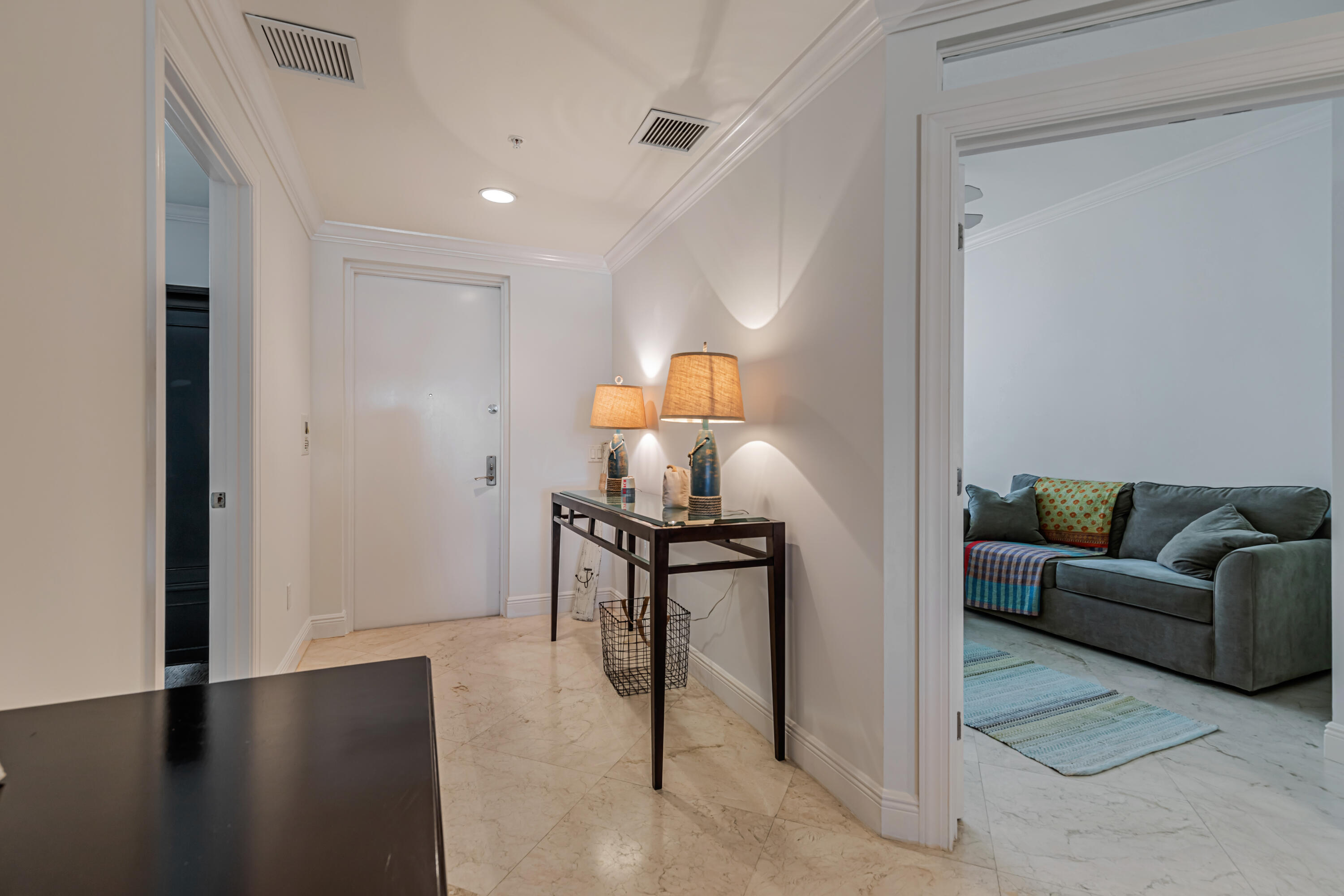 701 Southeast 21st Avenue, Unit 302 Deerfield Beach, FL 33441 - Photo 14 of 52 a living room with furniture a rug and a table