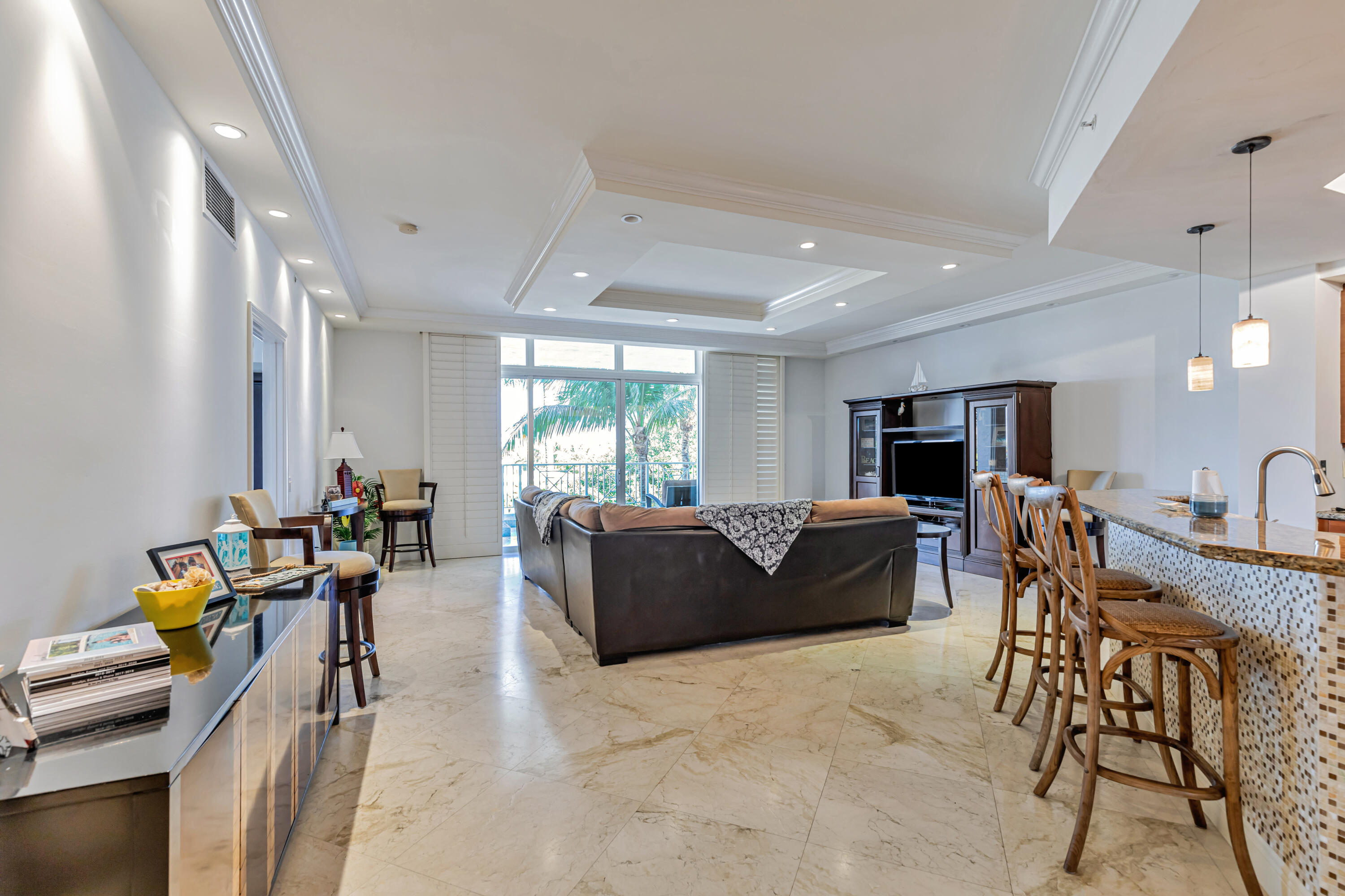 701 Southeast 21st Avenue, Unit 302 Deerfield Beach, FL 33441 - Photo 17 of 52 a living room with furniture and a large window