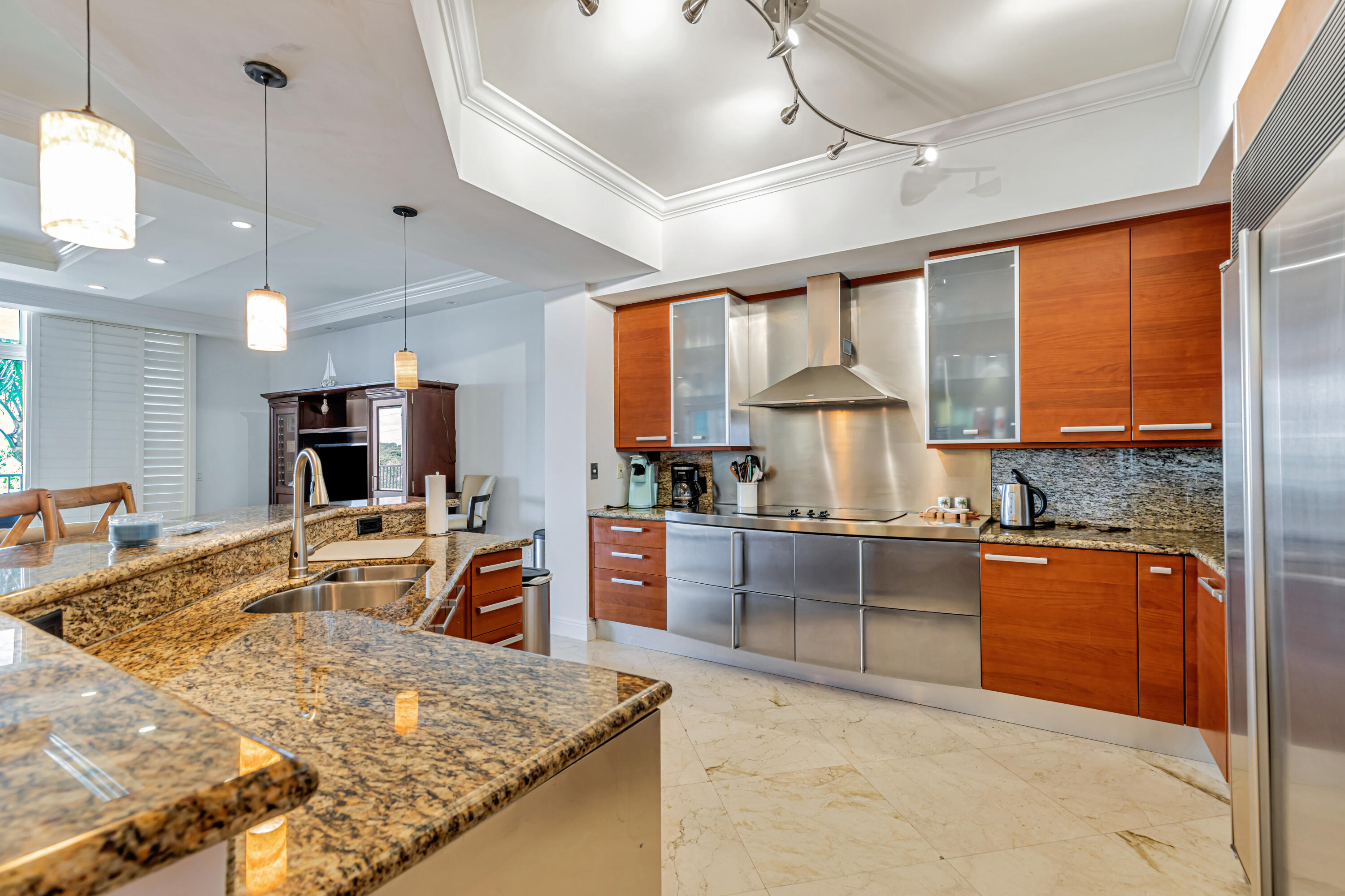 701 Southeast 21st Avenue, Unit 302 Deerfield Beach, FL 33441 - Photo 18 of 52 a kitchen with stainless steel appliances granite countertop sink stove top oven and refrigerator