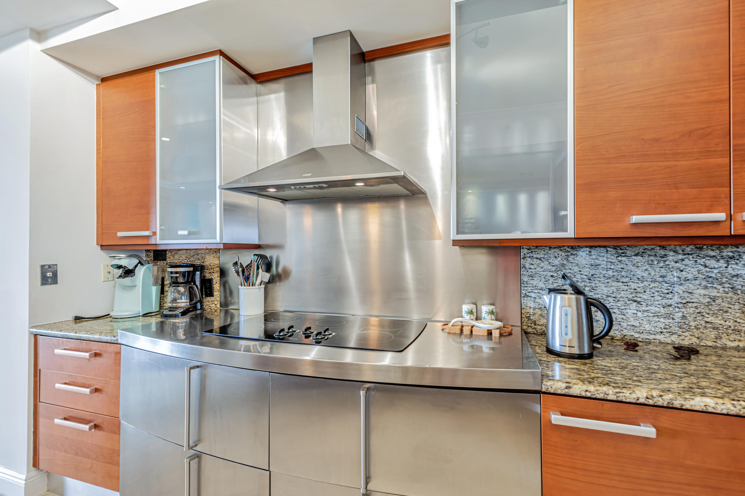 701 Southeast 21st Avenue, Unit 302 Deerfield Beach, FL 33441 - Photo 20 of 52 a kitchen with stainless steel appliances granite countertop a sink and cabinets