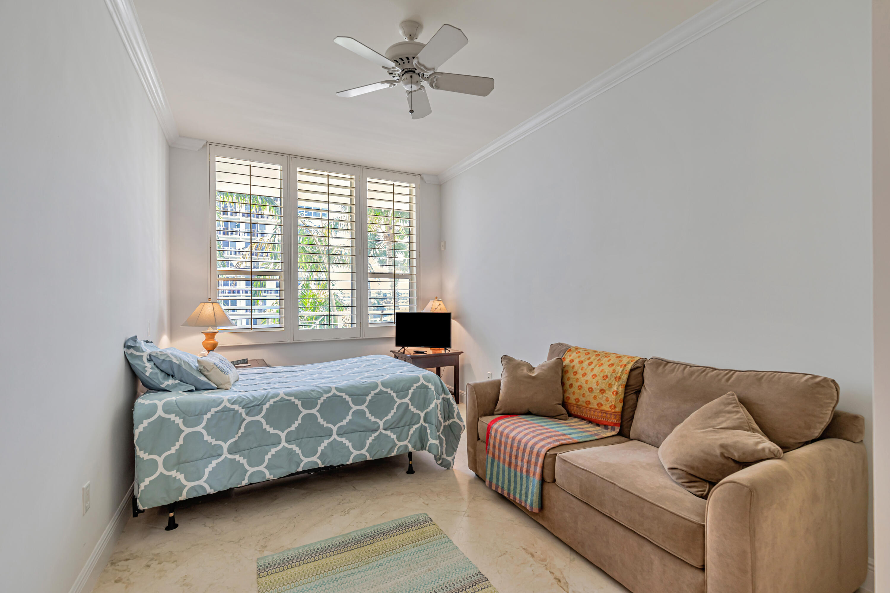 701 Southeast 21st Avenue, Unit 302 Deerfield Beach, FL 33441 - Photo 28 of 52 a bedroom with furniture and a couch