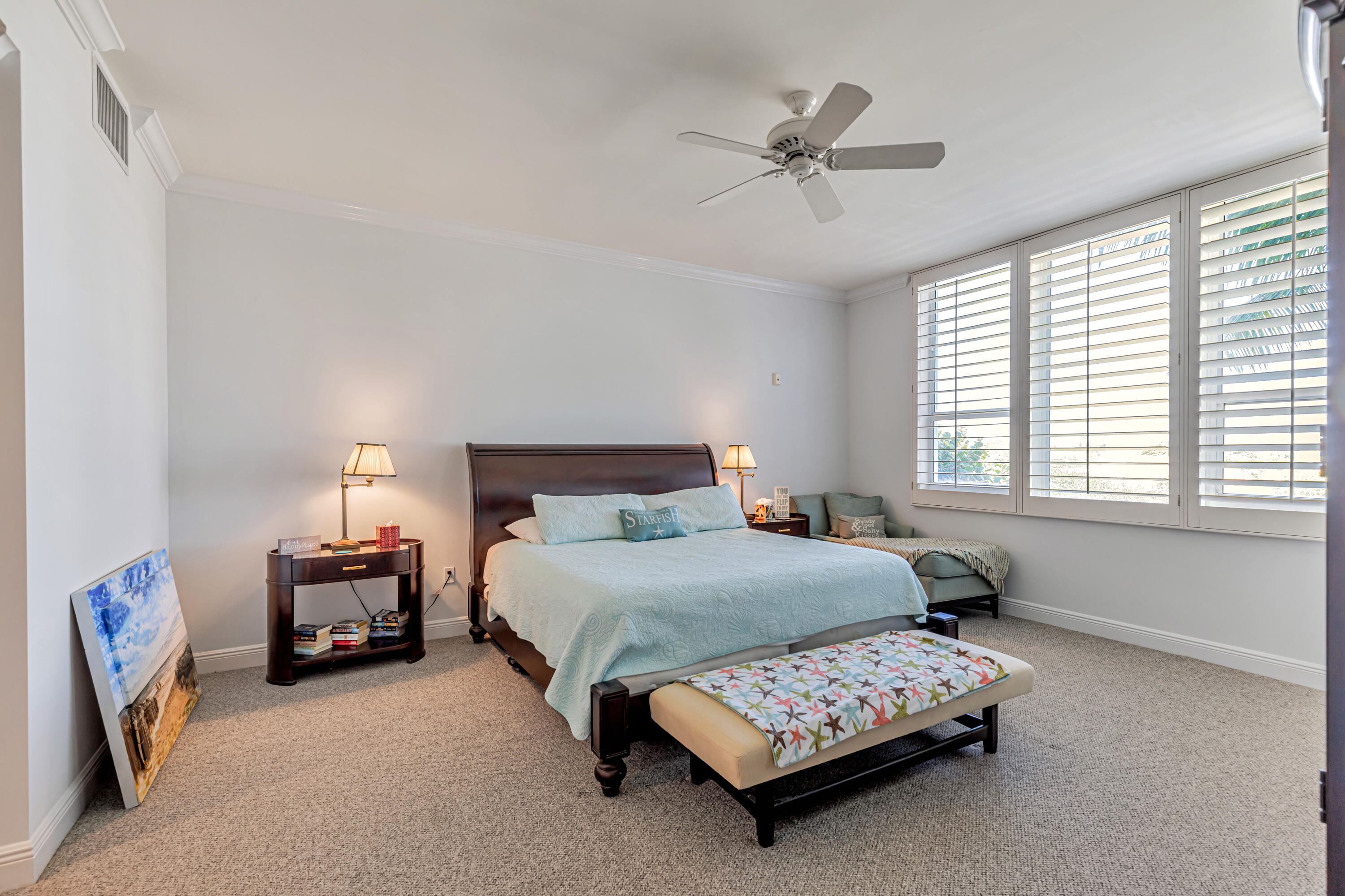 701 Southeast 21st Avenue, Unit 302 Deerfield Beach, FL 33441 - Photo 30 of 52 a bedroom with a bed mirror and window