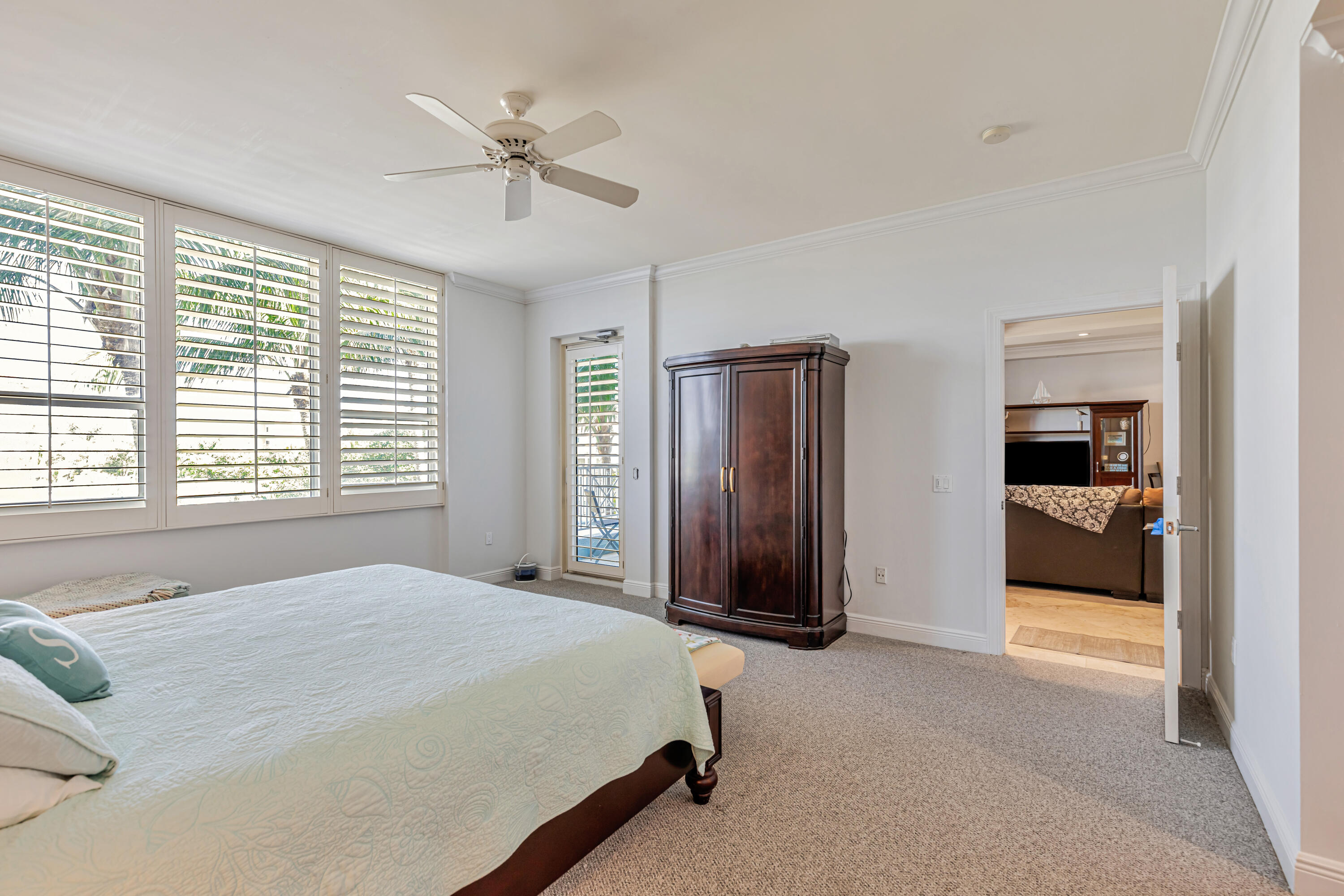 701 Southeast 21st Avenue, Unit 302 Deerfield Beach, FL 33441 - Photo 32 of 52 a bedroom with a bed and a large window