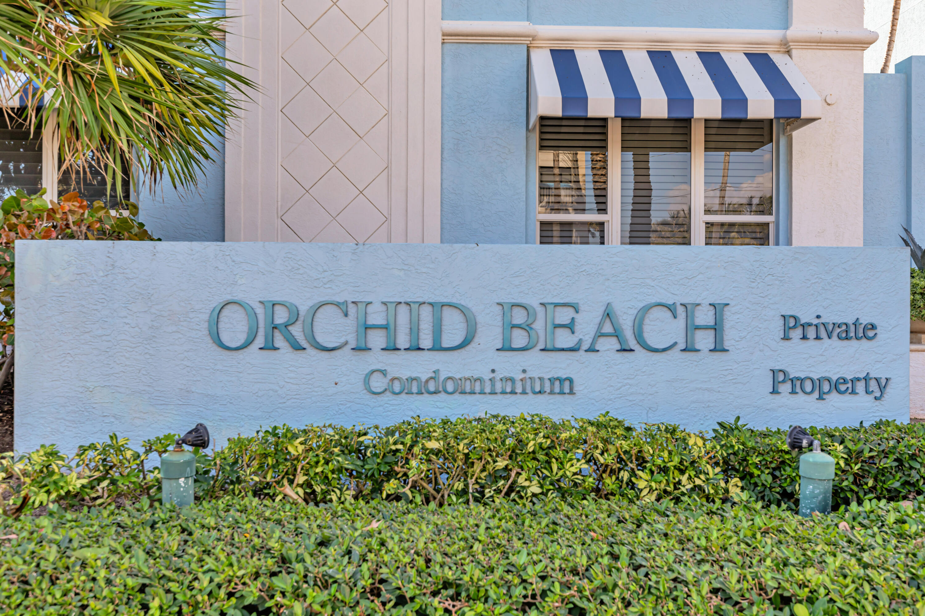 701 Southeast 21st Avenue, Unit 302 Deerfield Beach, FL 33441 - Photo 43 of 52 a building with sign in front of it