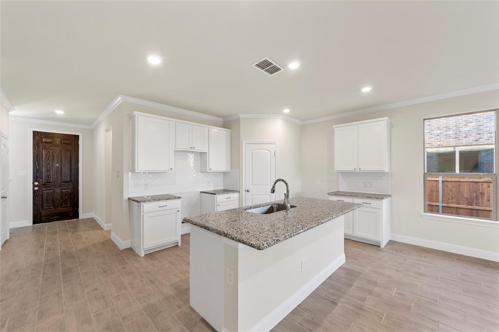 1529 Addison Lane Lancaster, TX 75134 - Photo 20 of 35 a kitchen with a sink granite counter top space and appliances