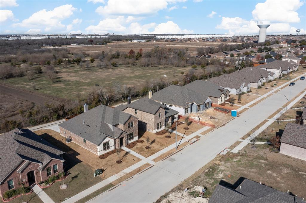 1529 Addison Lane Lancaster, TX 75134 - Photo 32 of 35 an aerial view of a house with a yard and lake view