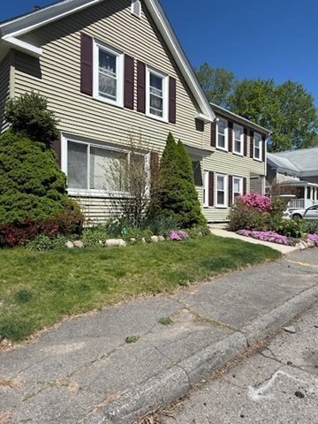 11 Elm Street, Unit 3 Ayer, MA 01432 - Photo 9 of 9 a front view of a house with a garden
