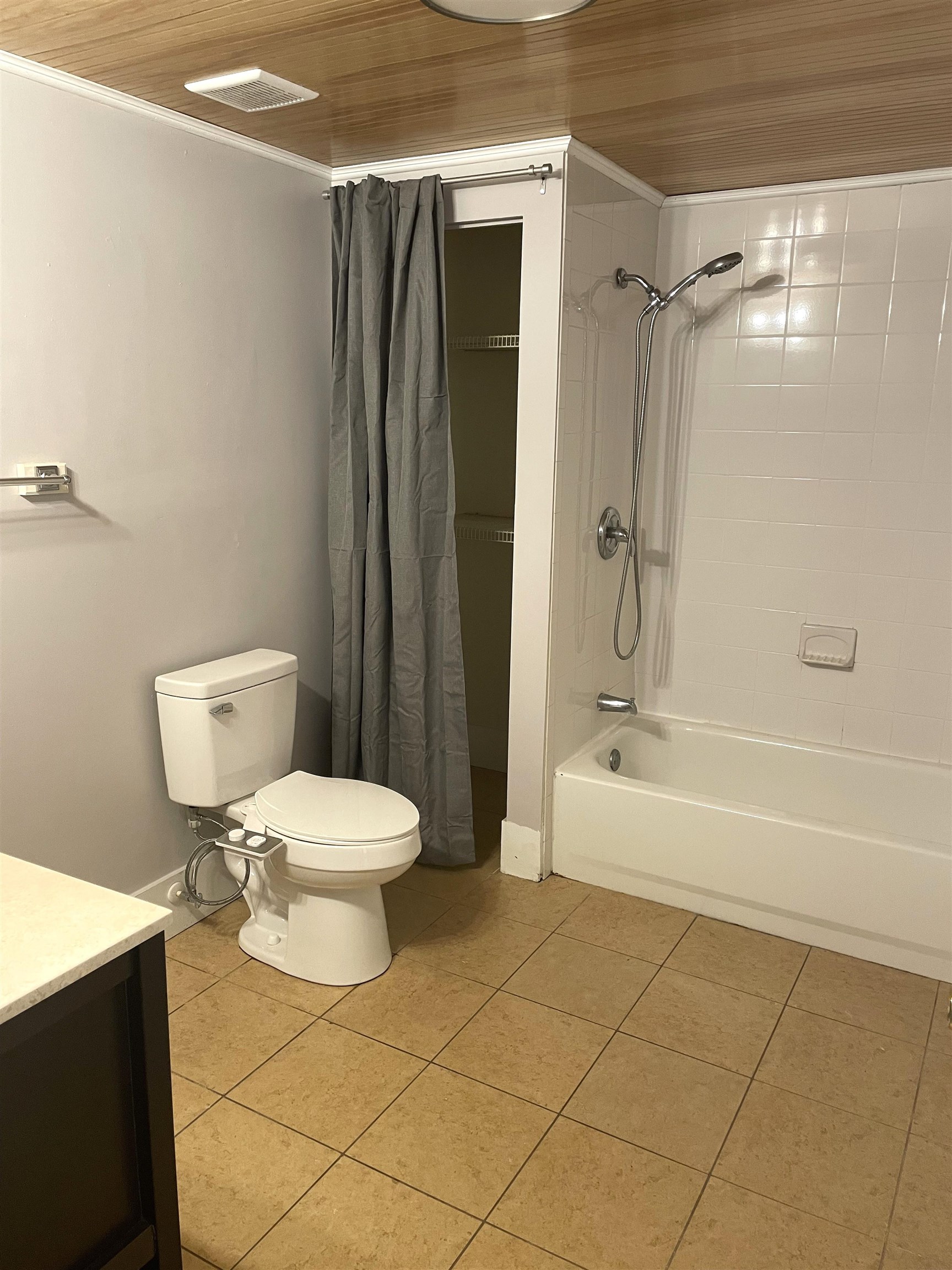 137.5 Riberia Street St. Augustine, FL 32084 - Photo 7 of 10 Full bath featuring vanity, light tile patterned floors, shower / bath combination with curtain, wooden ceiling, and ornamental molding