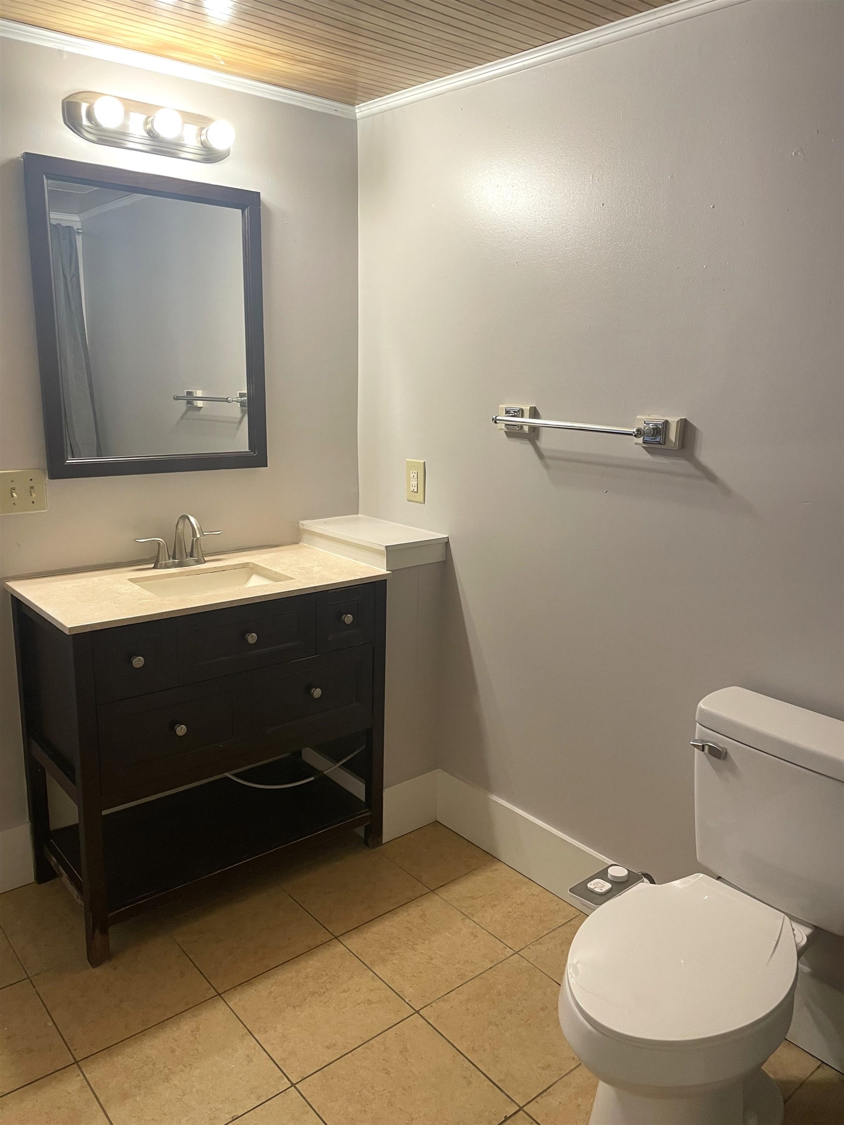 137.5 Riberia Street St. Augustine, FL 32084 - Photo 8 of 10 Bathroom with ornamental molding, vanity, and light tile patterned floors