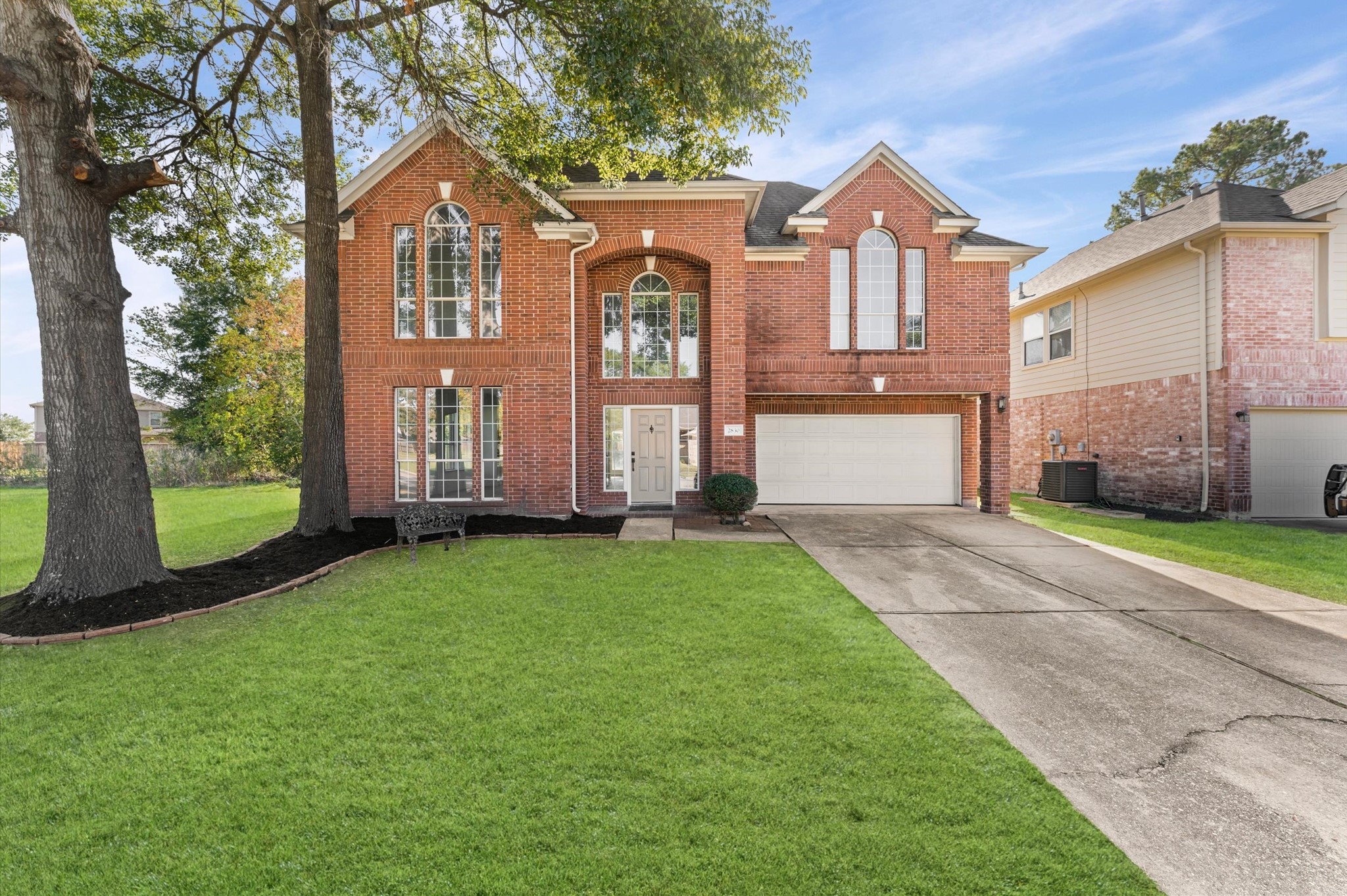 2830 Fern Hill Drive Spring, TX 77373 - Photo 2 of 39 a front view of a house with a garden and yard
