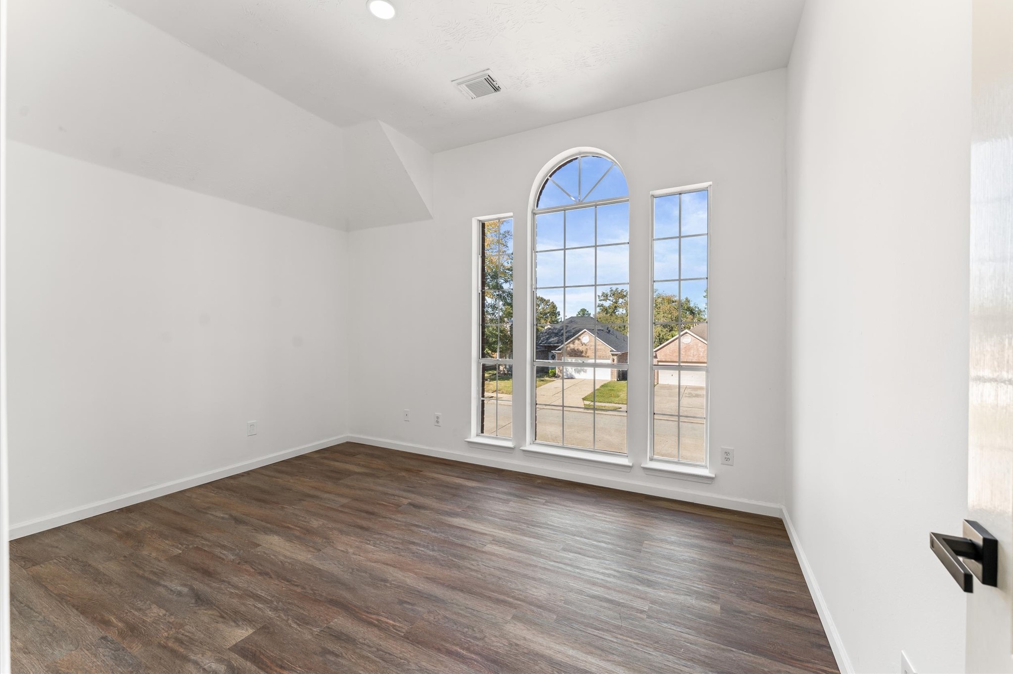 2830 Fern Hill Drive Spring, TX 77373 - Photo 32 of 39 an empty room with wooden floor and a window