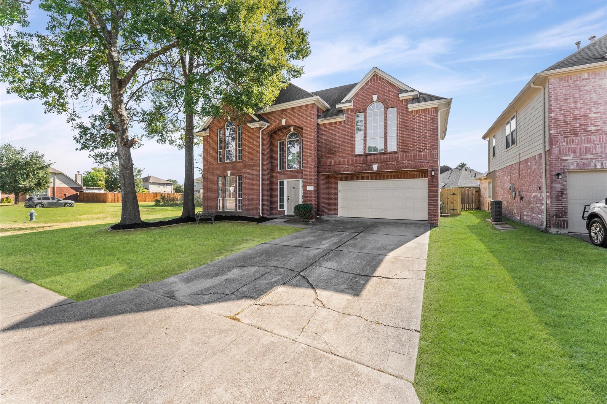 2830 Fern Hill Drive Spring, TX 77373 - Photo 4 of 39 a front view of a house with a garden and trees