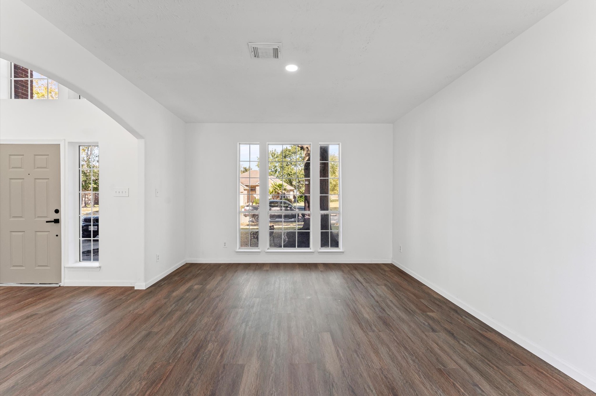 2830 Fern Hill Drive Spring, TX 77373 - Photo 9 of 39 wooden floor in an empty room with a window