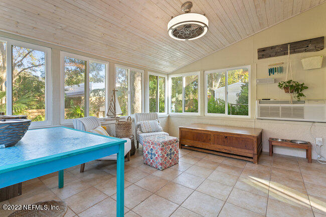 361 Shamrock Road St. Augustine, FL 32086 - Photo 21 of 30 a bedroom with a large bed and a large window