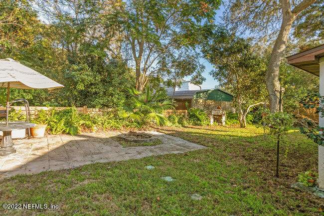 361 Shamrock Road St. Augustine, FL 32086 - Photo 25 of 30 a view of a yard with an trees