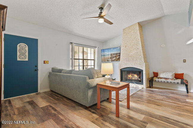 361 Shamrock Road St. Augustine, FL 32086 - Photo 4 of 30 a living room with furniture and a fireplace