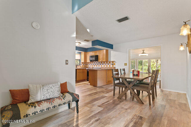 361 Shamrock Road St. Augustine, FL 32086 - Photo 6 of 30 a living room with furniture and a wooden floor