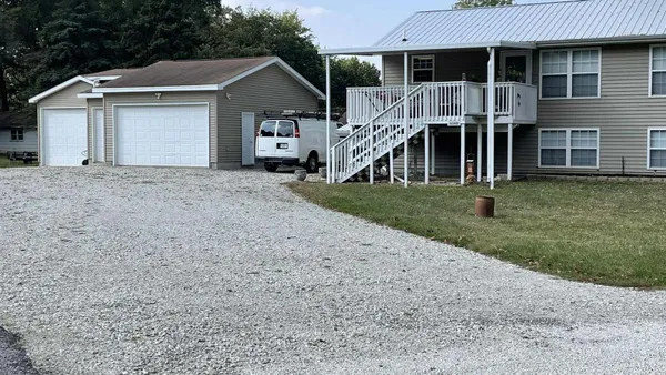 a house view with a backyard space