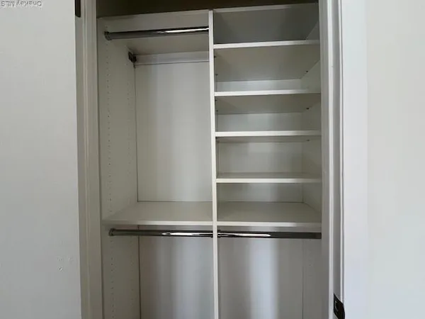 a bathroom with a granite countertop sink a toilet and bathtub