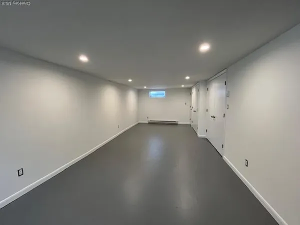 a view of room and hall with a window