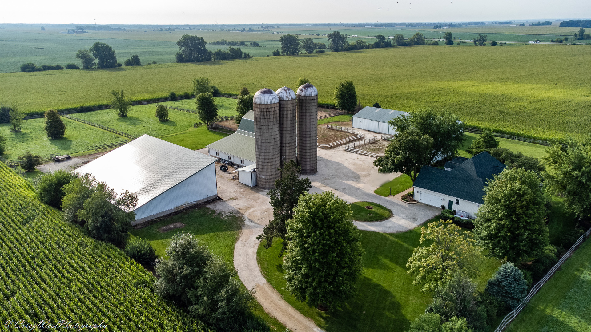 N307 Watson Road Maple Park, IL 60151 - Photo 2 of 65 a view of a lake with a yard and large trees