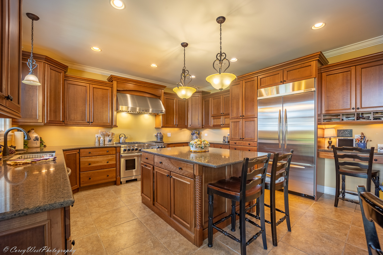 N307 Watson Road Maple Park, IL 60151 - Photo 15 of 65 a kitchen with stainless steel appliances granite countertop a stove top oven a sink a dining table and chairs with wooden floor