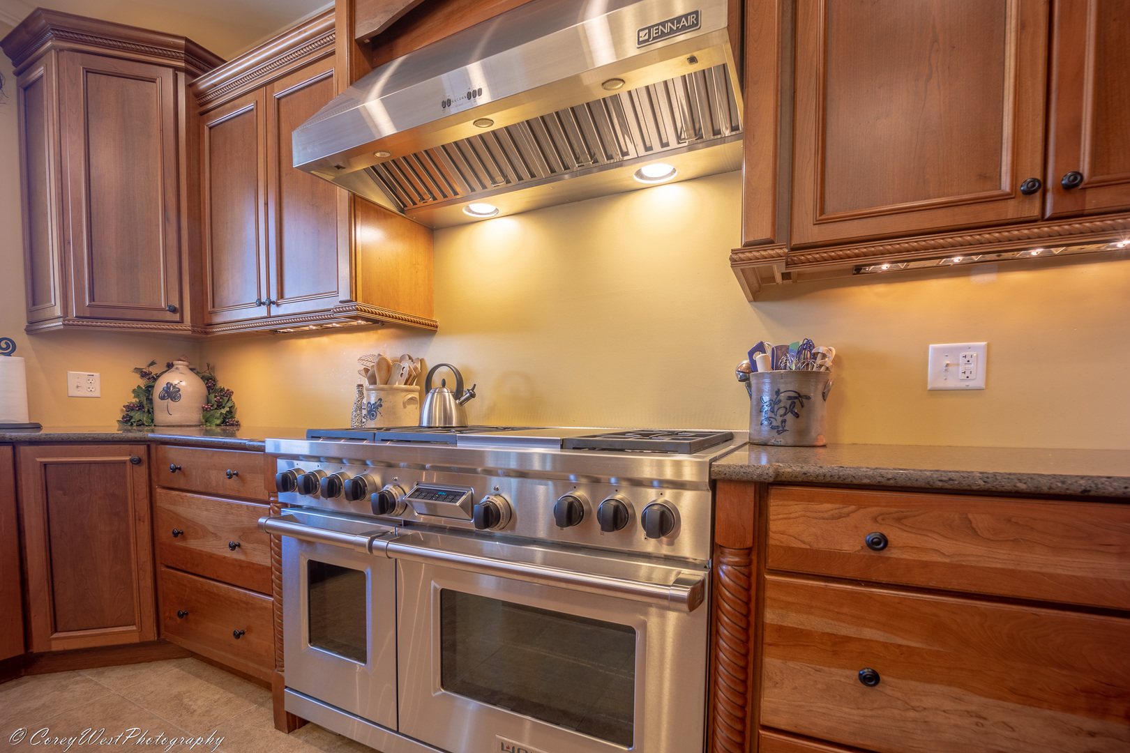 N307 Watson Road Maple Park, IL 60151 - Photo 19 of 65 a kitchen with granite countertop a stove and a wooden cabinets