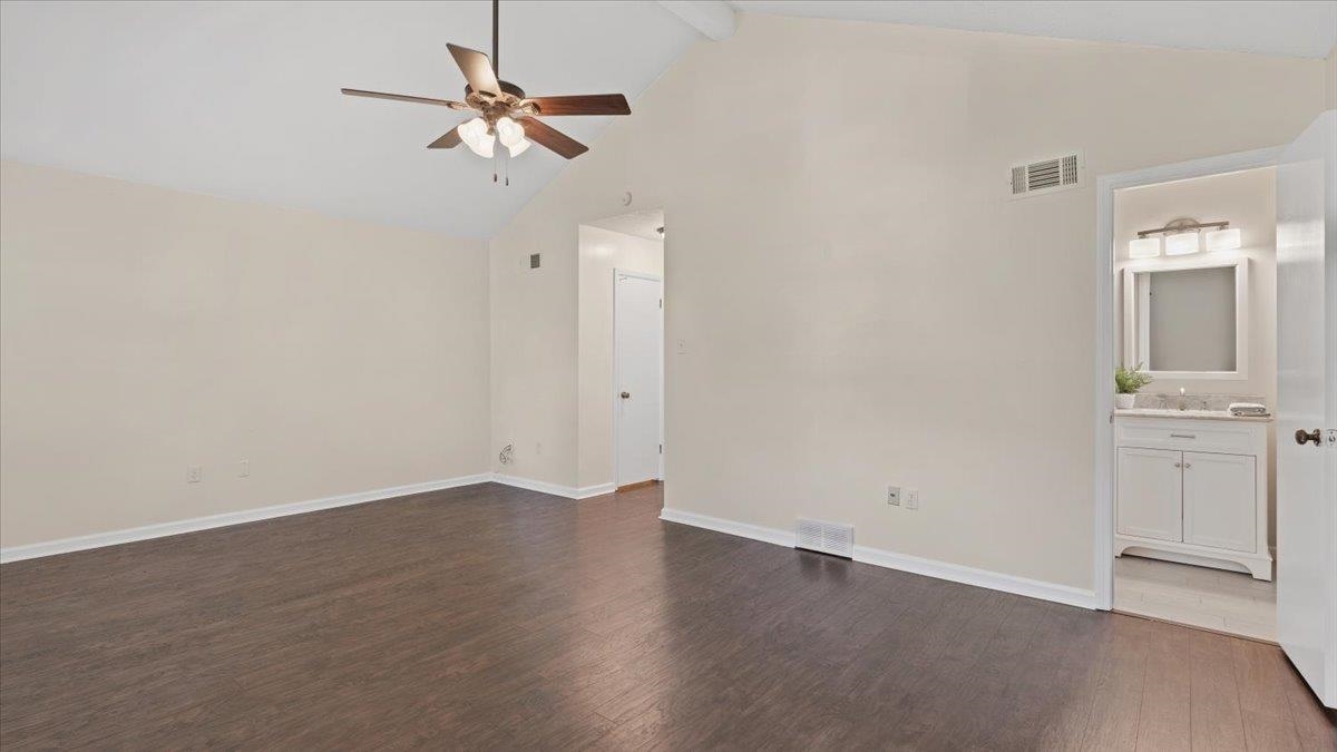 1707 Falling Leaf Road Germantown, TN 38138 - Photo 21 of 38 Unfurnished bedroom featuring high vaulted ceiling, ensuite bath, ceiling fan, and dark hardwood / wood-style floors
