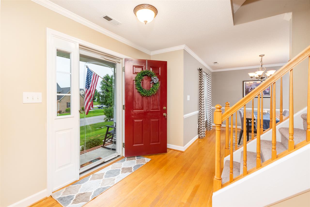 65 Long Bow Road Waynesboro, VA 22980 - Photo 16 of 50 a bedroom with a bed and a chandelier