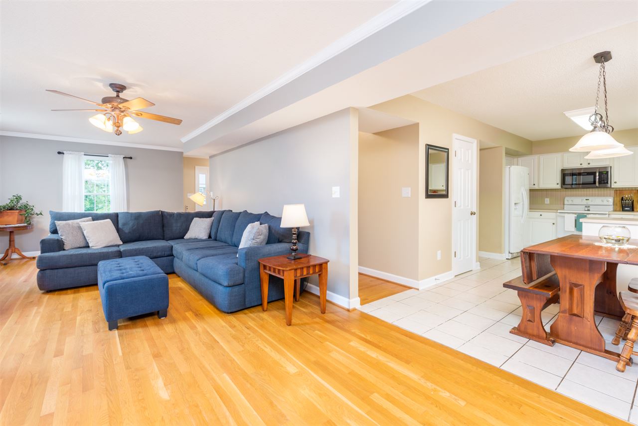 65 Long Bow Road Waynesboro, VA 22980 - Photo 18 of 50 a living room with furniture and a dining table with wooden floor