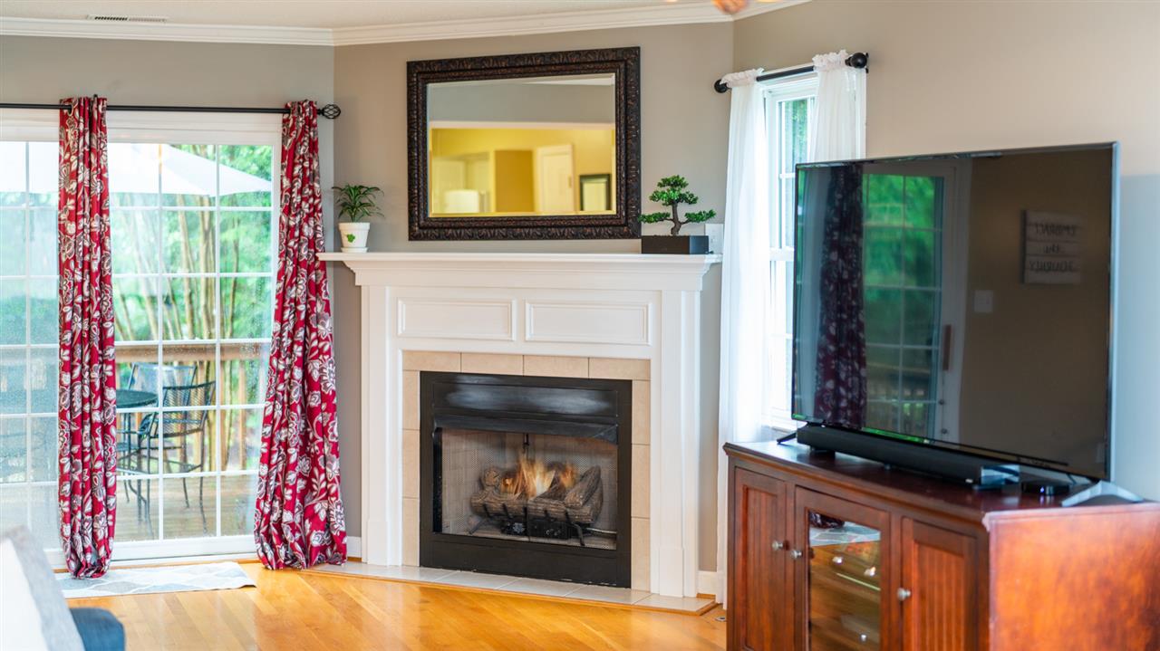 65 Long Bow Road Waynesboro, VA 22980 - Photo 19 of 50 a living room with a fireplace and a flat screen tv