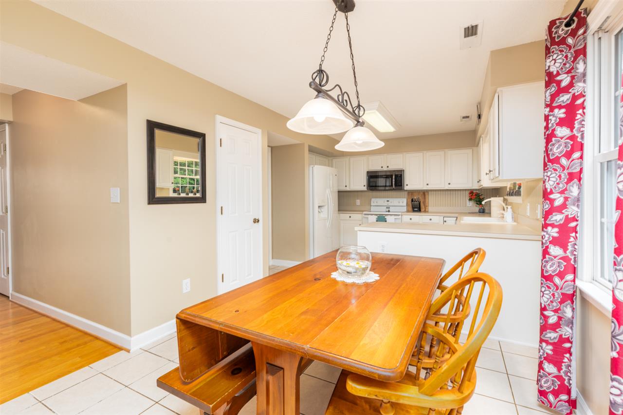 65 Long Bow Road Waynesboro, VA 22980 - Photo 22 of 50 a dining room with stainless steel appliances kitchen island granite countertop furniture and a chandelier
