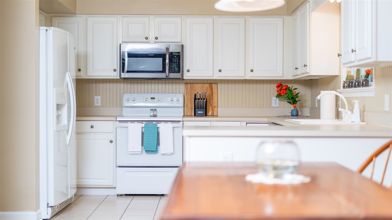 65 Long Bow Road Waynesboro, VA 22980 - Photo 28 of 50 a kitchen with stainless steel appliances a white stove top oven and white cabinets