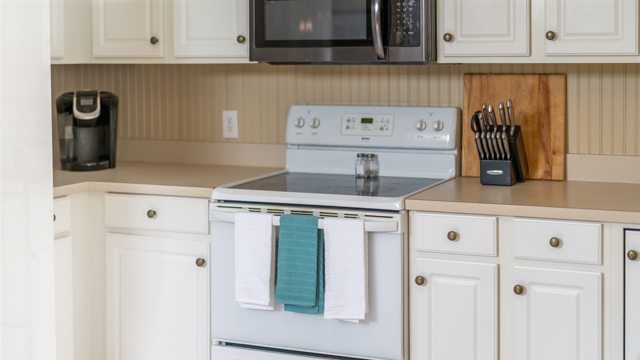 65 Long Bow Road Waynesboro, VA 22980 - Photo 30 of 50 a kitchen with stainless steel appliances granite countertop a refrigerator and a stove