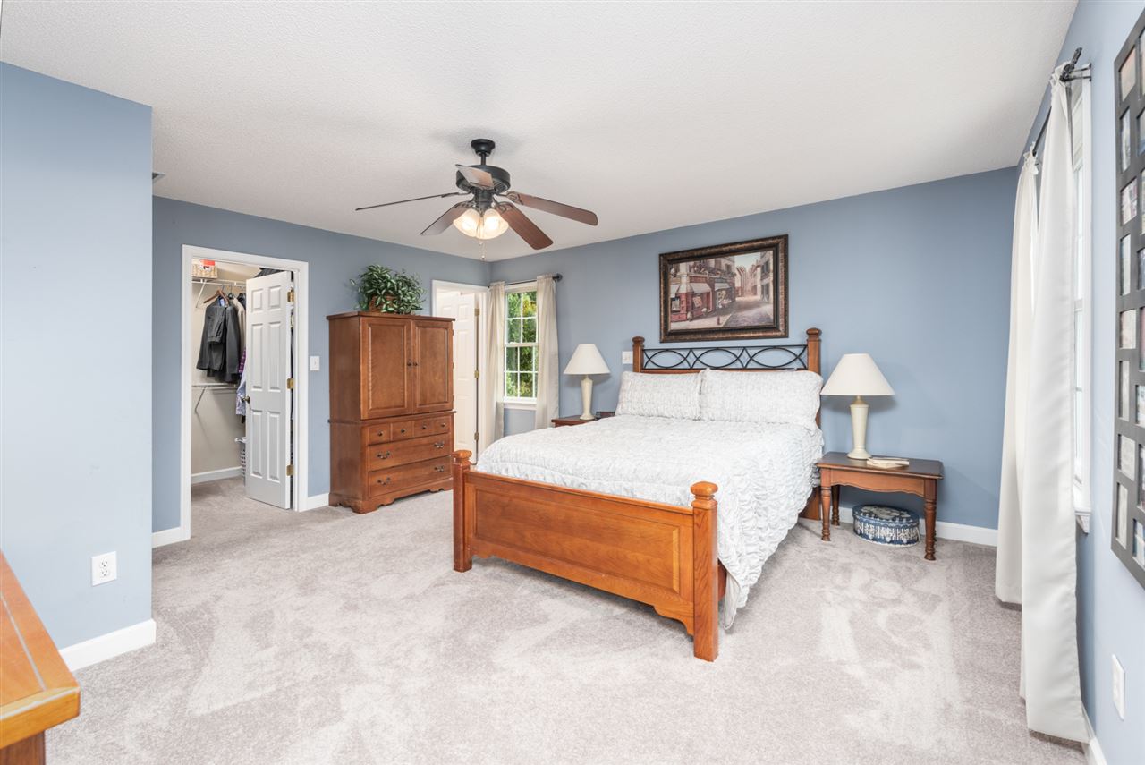 65 Long Bow Road Waynesboro, VA 22980 - Photo 39 of 50 a spacious bedroom with a bed and a lamp
