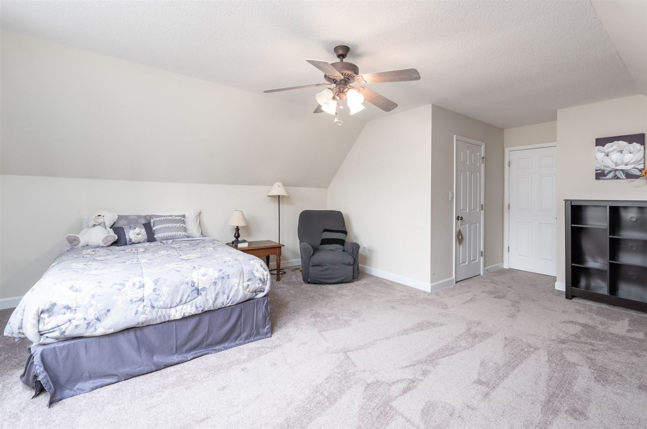 65 Long Bow Road Waynesboro, VA 22980 - Photo 50 of 50 a spacious bedroom with a bed and a chandelier