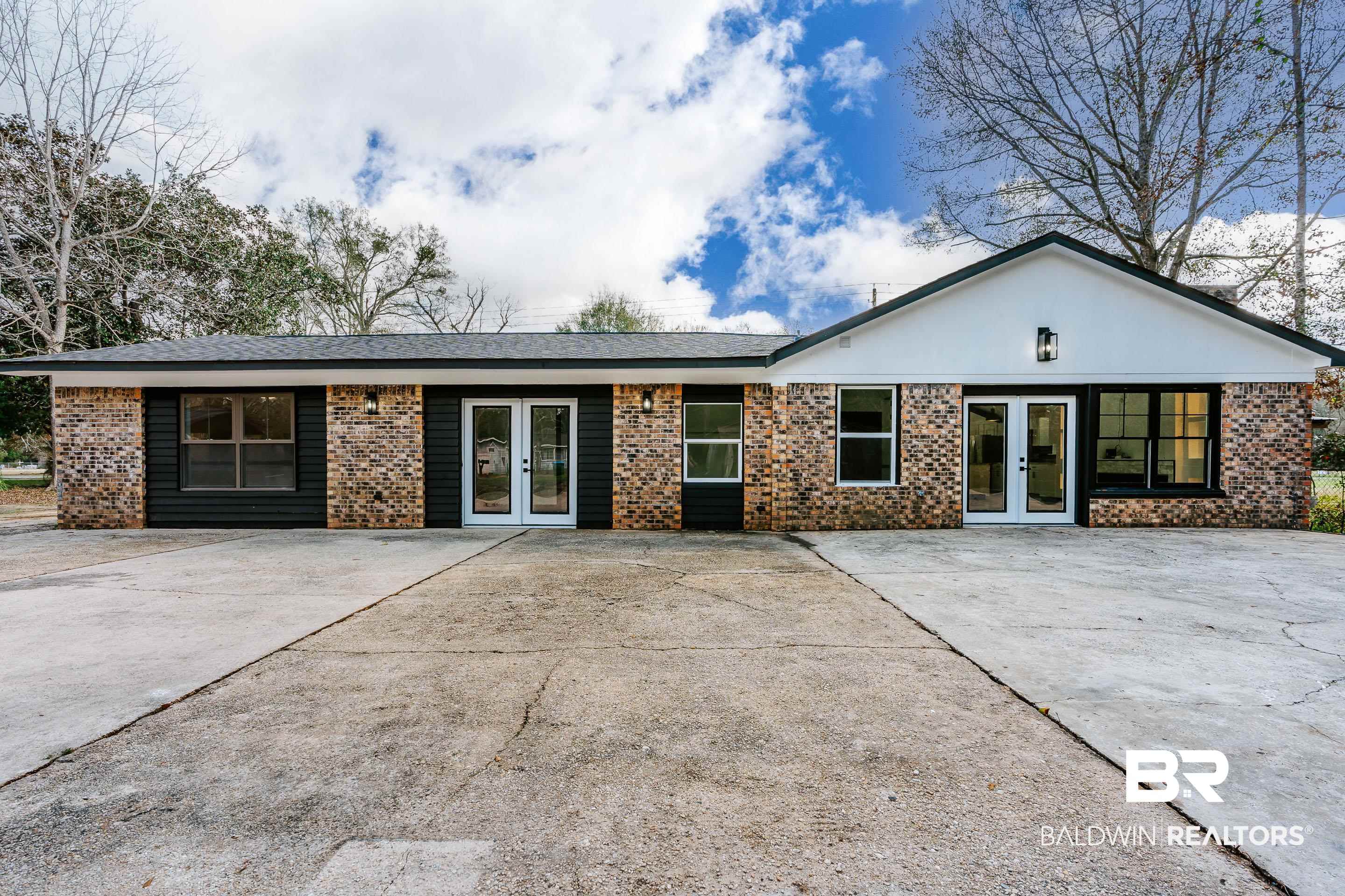 1190 Military Road Mount Vernon, AL 36560 - Photo 42 of 47 View of front of house featuring french doors, brick siding, and a patio