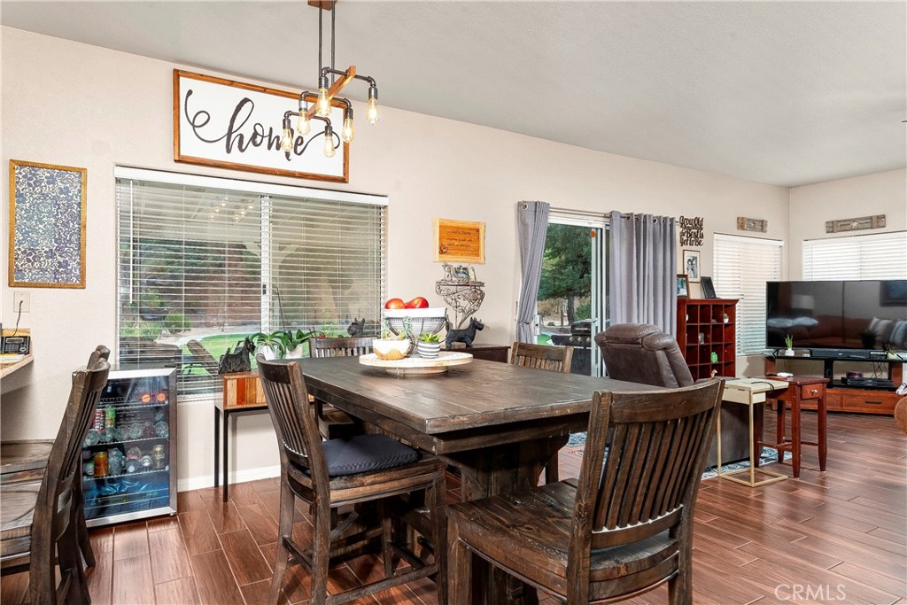 32201 Joaquin Road Acton, CA 93510 - Photo 25 of 75 a view of a dining room with furniture window and wooden floor