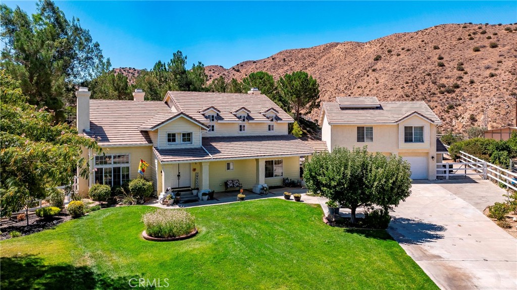 32201 Joaquin Road Acton, CA 93510 - Photo 3 of 75 a front view of a house with a yard table and chairs