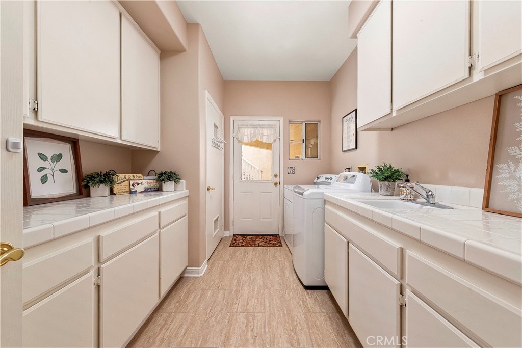 32201 Joaquin Road Acton, CA 93510 - Photo 32 of 75 a kitchen with cabinets a sink and appliances