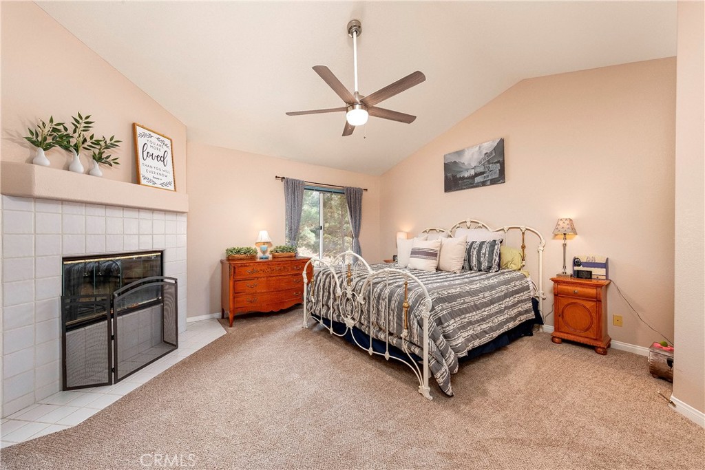 32201 Joaquin Road Acton, CA 93510 - Photo 34 of 75 a bed room with a bed and a fireplace